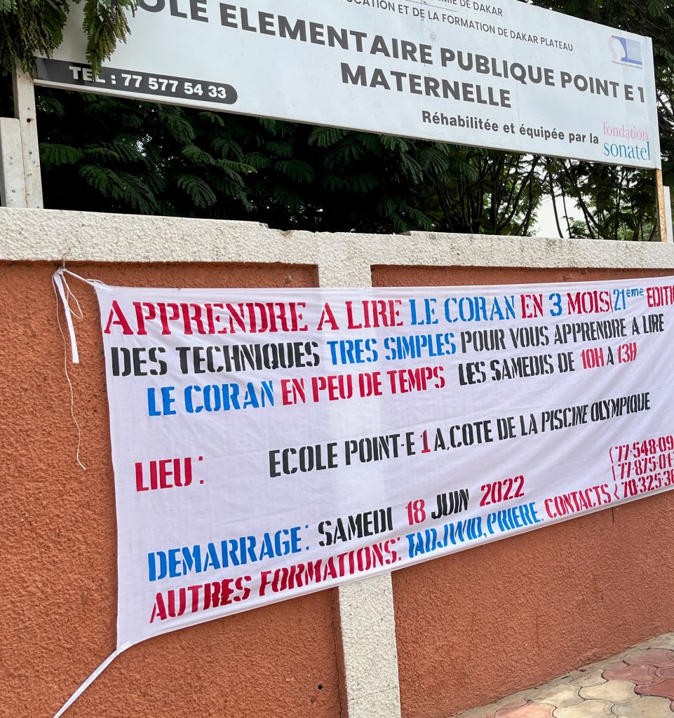 A banner on a wall outside a primary school in Senegal
